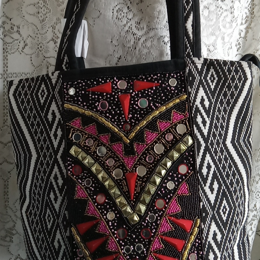 XLarge Tote Designed so well.13 Inches tall 16 across.